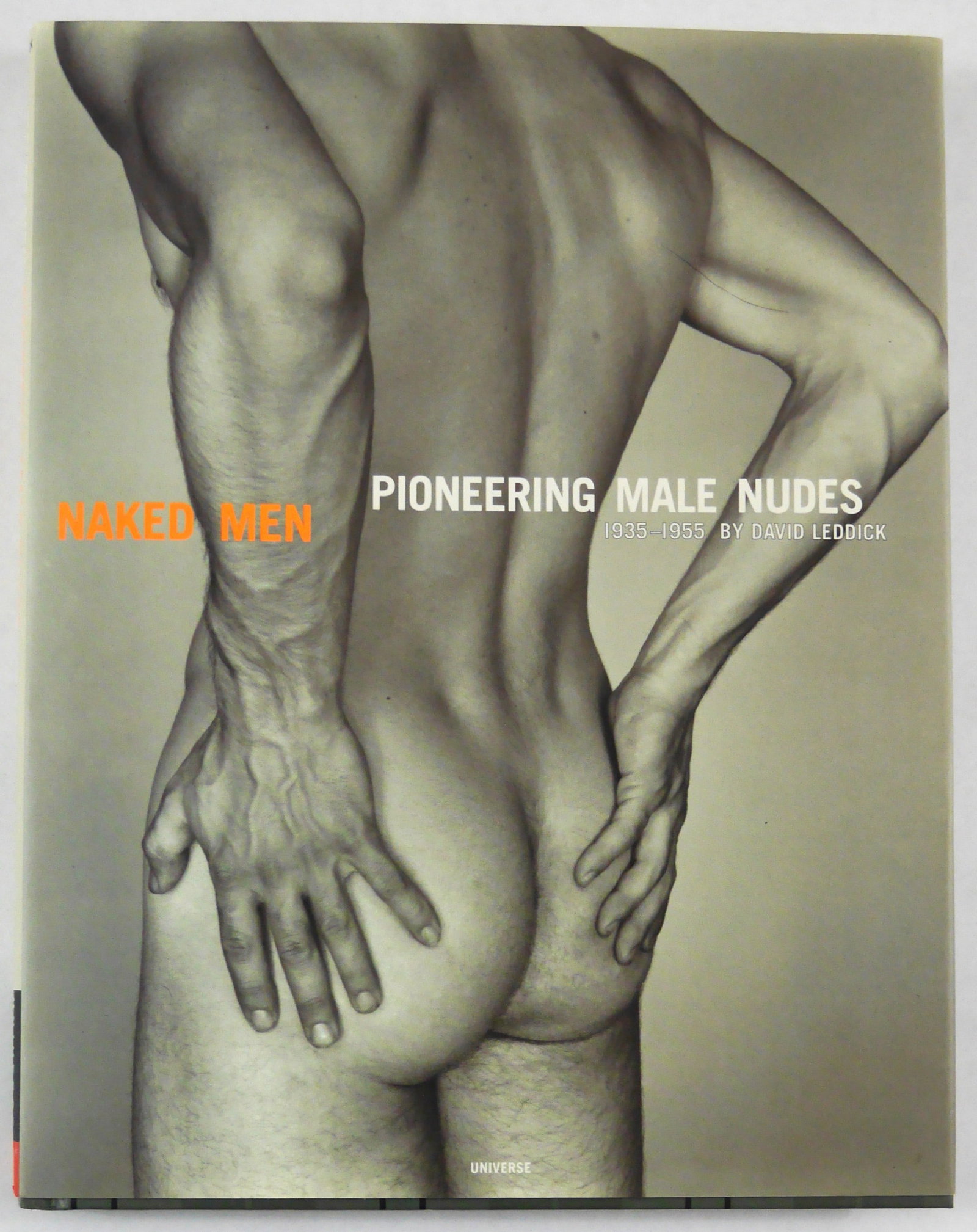 Leddick, David; Naked Men: Pioneering Male Nudes 1935-1955: Universe, 1997. Hardcover in pictorial dust jacket. First Edition, First Printing (with full numberline ending in 1).? 12 x 11 inches. 128 pages with numerous phorographic images throughout accompanie