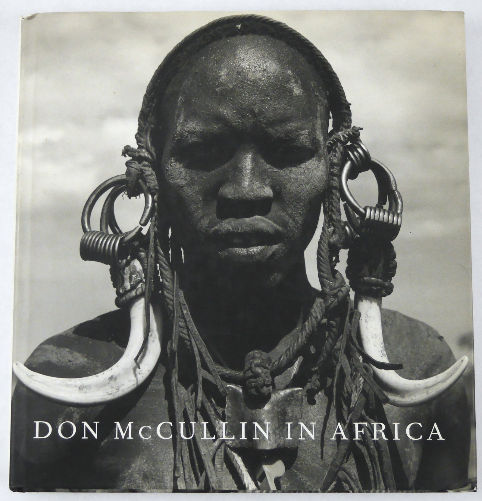 Don McCullin in Africa [2005 1ST EDITION 1ST PRINTING - FINE]: Jonathan Cape, 2005. Hardcover in pictorial dust jacket. First Edition, First Printing (with the full numberline ending in 1). Unpaginated with circa 200 pages filled with black and white photographic