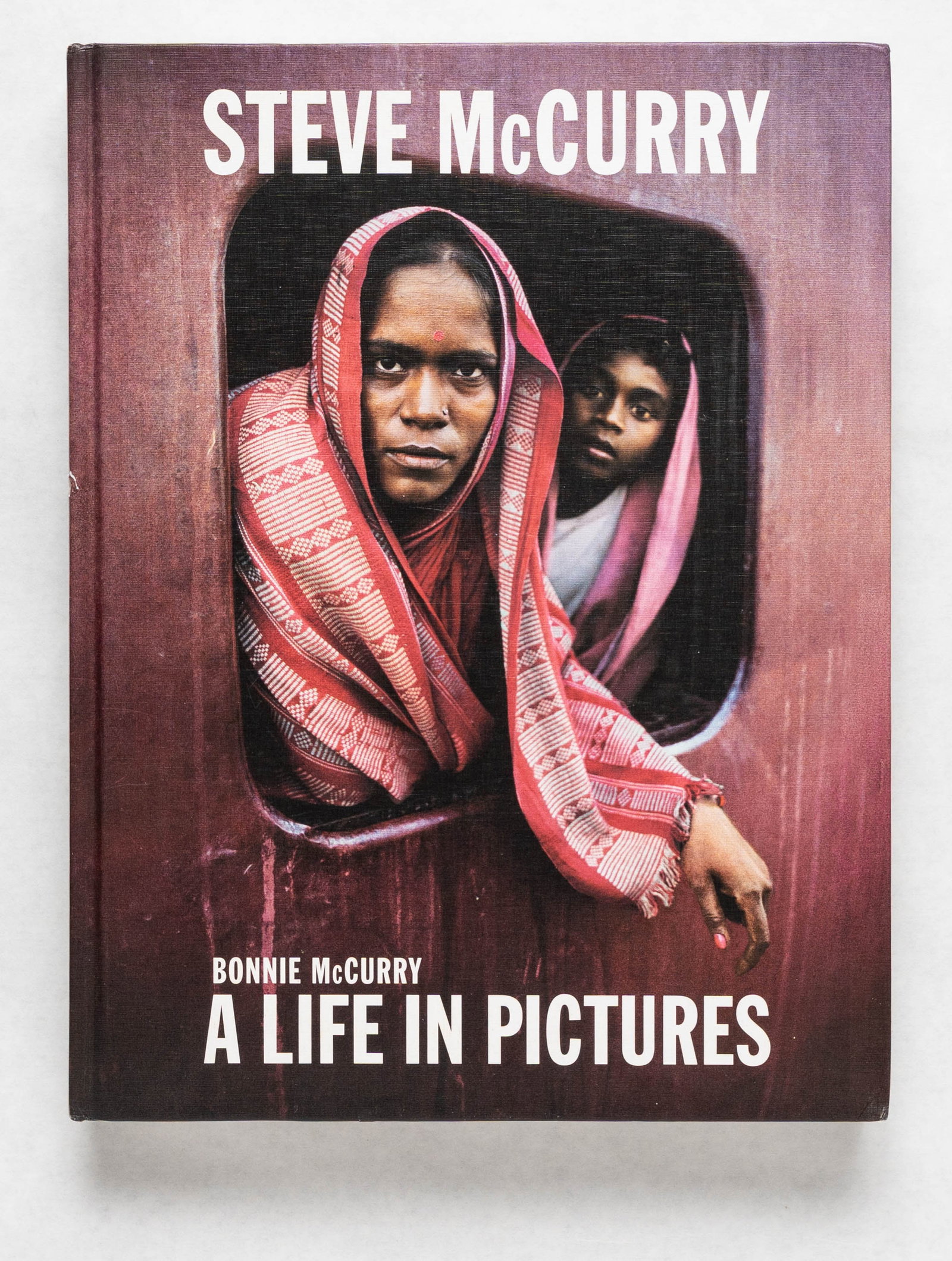 McCurry, Steve; A Life in Pictures [2018 1ST EDITION]: Lawrence King, 2018. Hardcover in pictorial boards. First Edition, First Printing. 15 x 12 inches. 329 pages filled with color photographic images throughout by Steve McCurry (40 years of iconic McCur