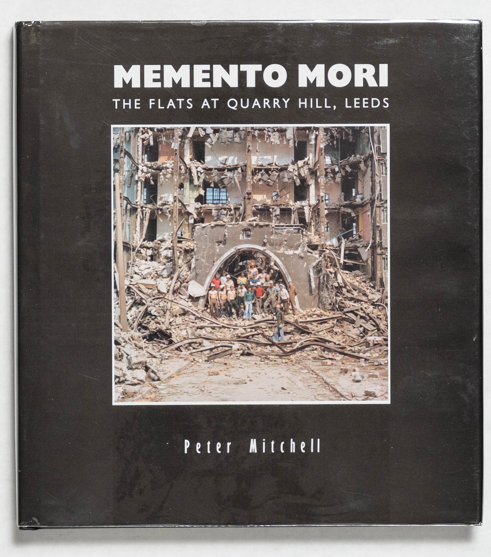 Mitchell, Peter; Memento Mori: The Flats at Quarry Hill, Leeds [1990 STATED 1ST ED HARDCOVER]: Smith Settle, 1990. Hardcover in pictorial Dust Jacket. First Edition (stated), First Printing. 132 pages profusely illustrated with black and white and colour photographs, maps, transparencies etc. P
