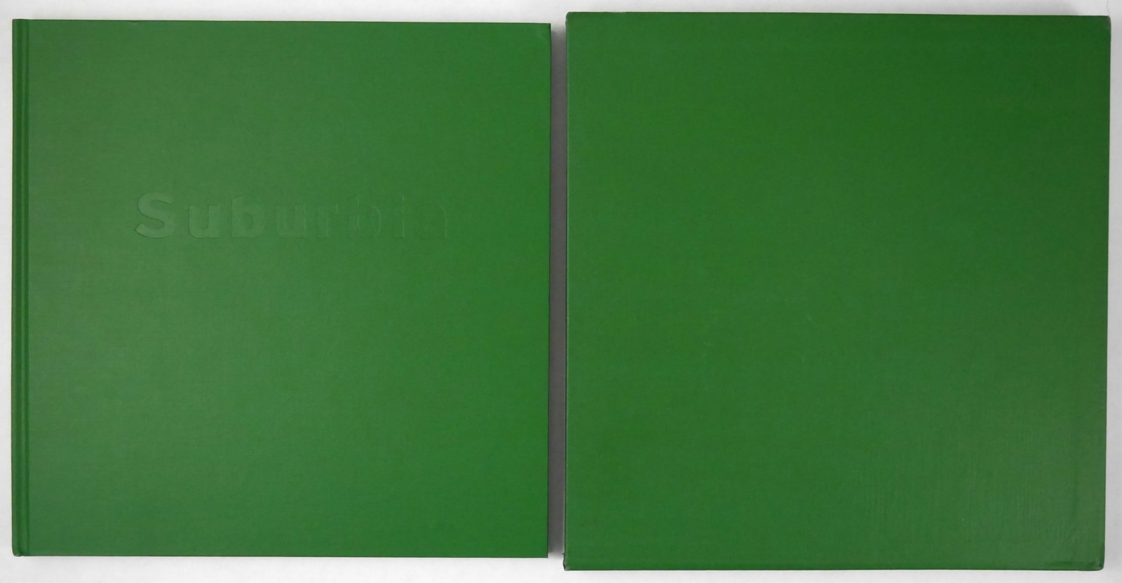 Owens, Bill; Suburbia [RARE 1973 1ST ED HARDCOVER IN SLIPCASE]: San Francisco: Straight Arrow Books 1973. Hardcover in matching slipcase. First Edition, First Printing (stated). 108 pages with 128 black-and-white photographs. Design by Jan Goodchild. Cited in The 