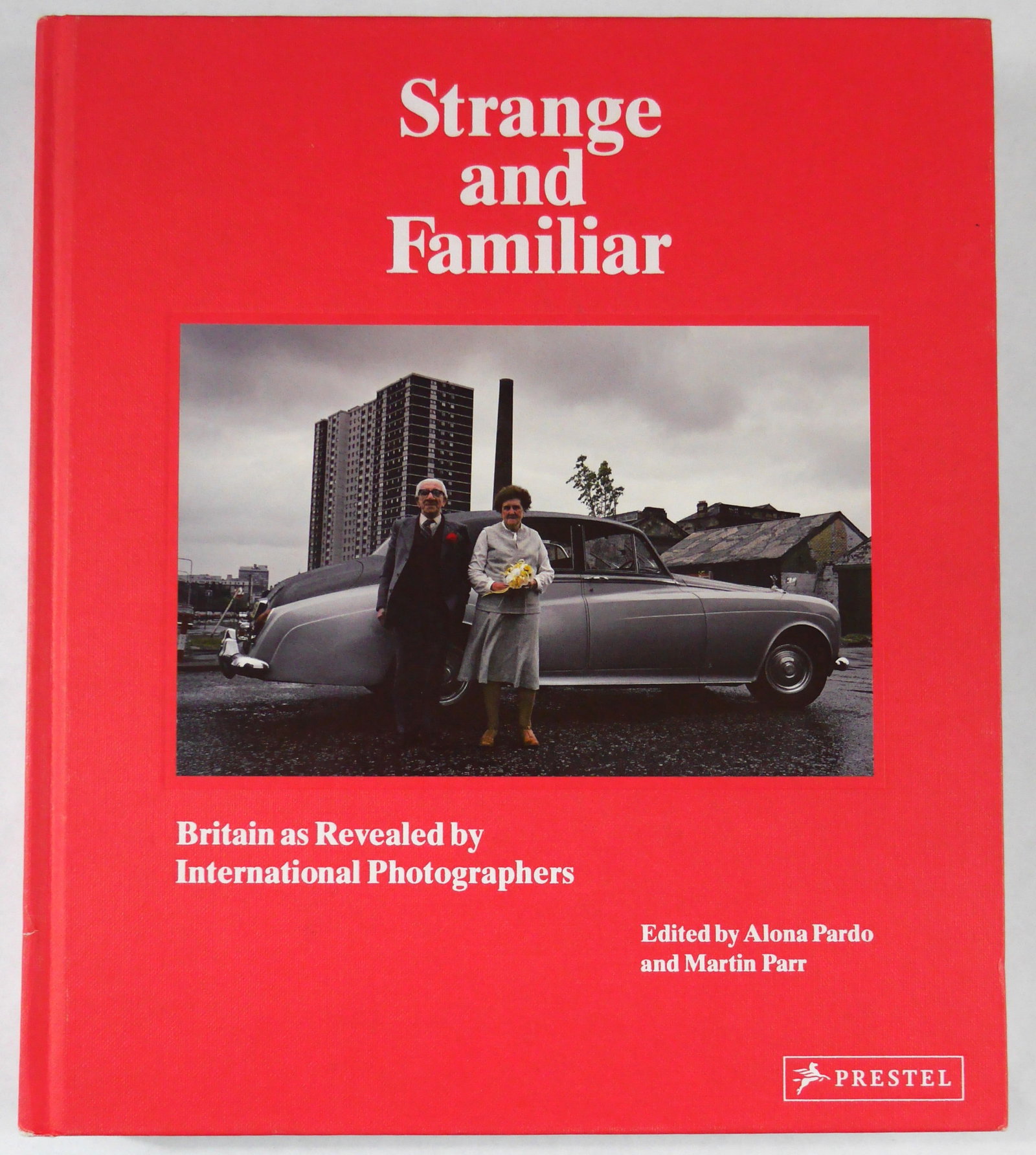 Parr, Martin; Pardo, Alona; Strange and Familiar Britain as Revealed by International Photographers: Prestel, 2016. Hardcover with tipped in image to front cover. First Edition, First Printing. 287 pages with numerous black and white and color photographic images throughout. BOOK CONDITION: Near Fine