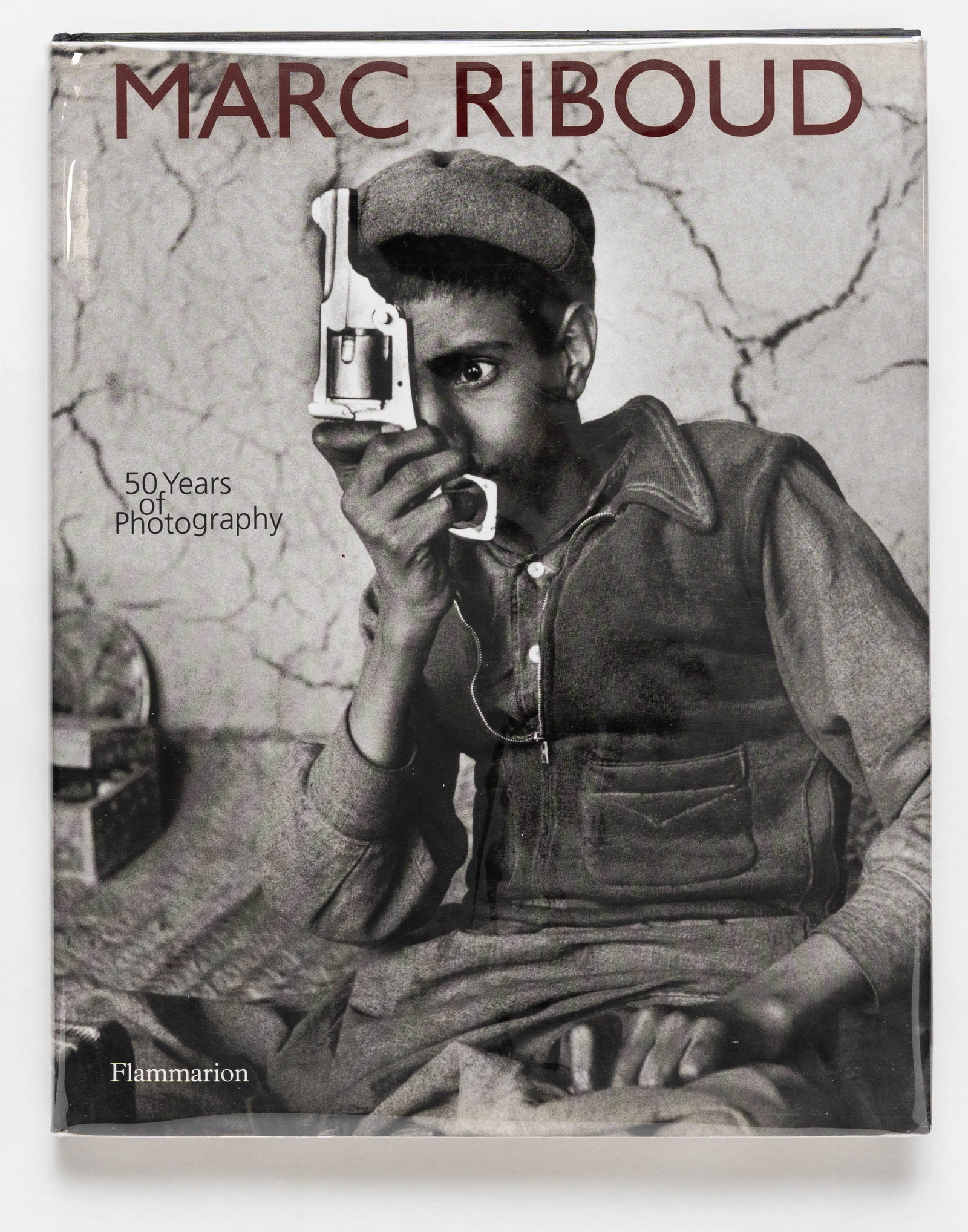 Marc Riboud, 50 Years of Photography [SIGNED 2004 1ST ED 1ST PRINT - FINE]: SIGNED COPY - Flammarion, 2004. Hardcover in pictorial dust jacket. First Edition, First Printing (with numberline ending in 1). 175 pages with numerous photographic images in black and white througho