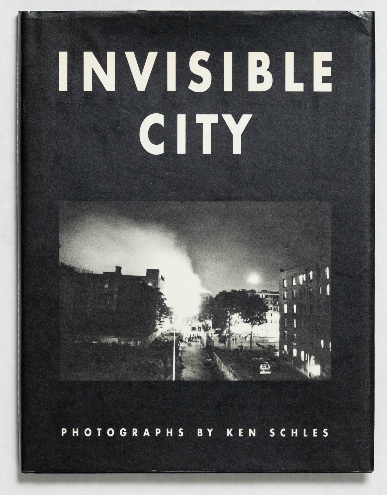 Schles, Ken; Invisible City [1988 1ST EDITION & 1ST PRINTING]: Los Angeles, CA: Twelvetrees Press(1988) . Hardcover in pictorial dust jacket. First Edition / First Printing. Unpaginated. The artist/photographer's breakthrough debut collection. Photographs by Ken 