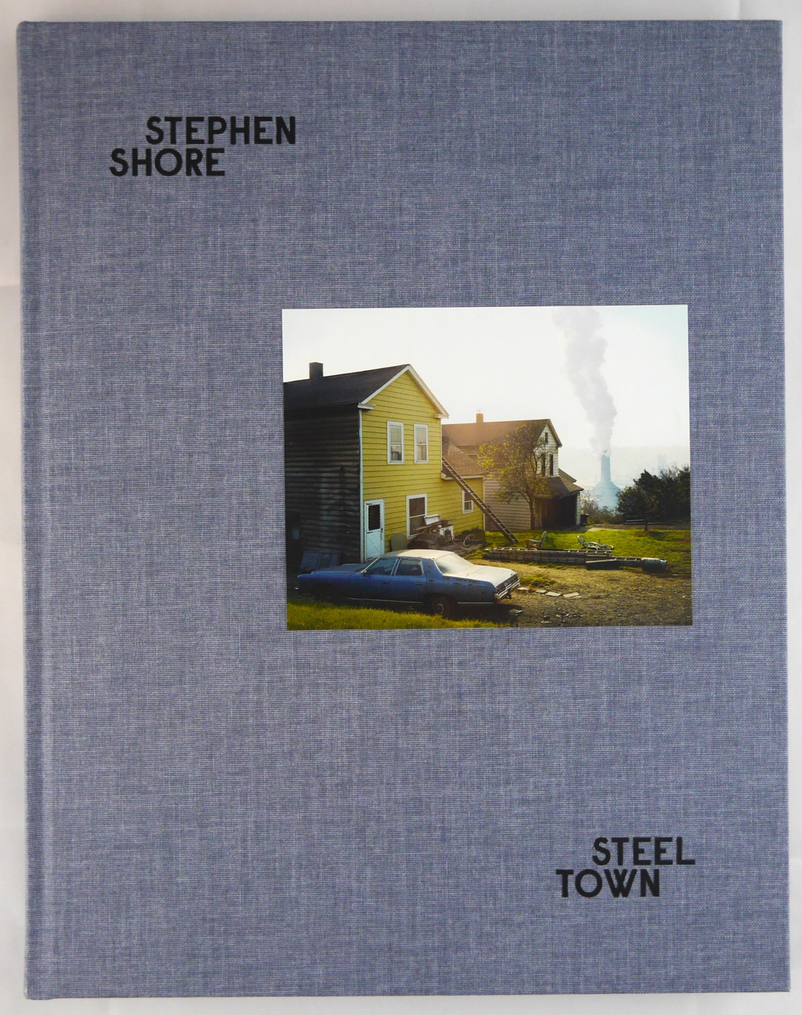 Shore, Stephen; Steel Town [SIGNED - 2021 MACK 1ST EDITION & 1ST PRINTING - FINE COPY]: Mack Books, London. 2021. First edition, first printing. Embossed hardback with tipped-in image. 104 pages. With text in English by Helen C. Epstein. SIGNED by Stephen Shore on an extra photogaphic im