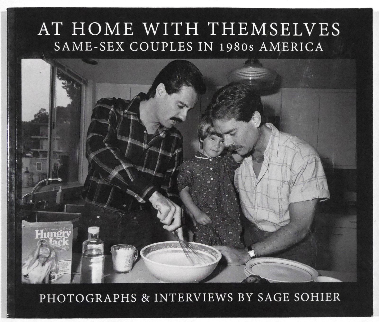 Sohier, Sage; At Home With Themselves: Same-Sex Couples in 1980's America [SIGNED]: Spotted Books, 2014. SIGNED - Softcover in pictorial wrappers. First Edition, First Printing. 122 pages with 56 black & white photographs showcasing Sage Sohier's intimate portraits of committed gay c