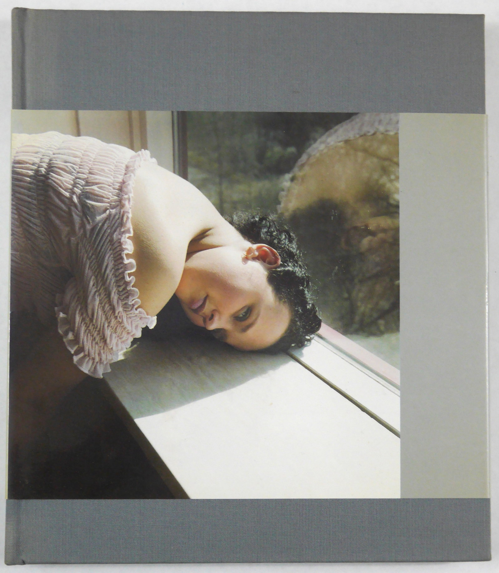 Van Meene, Helen; Untitled monograph [FINE COPY with BELLY BAND]: Gabrius Edizione, Milan, 2000. 68 pp. Hardcover with belly band. Quarto. First edition, First Printing. 30 color reproductions. Design by Hellen van Meene and Bureau Gras. Book Condition: Fine; a tigh