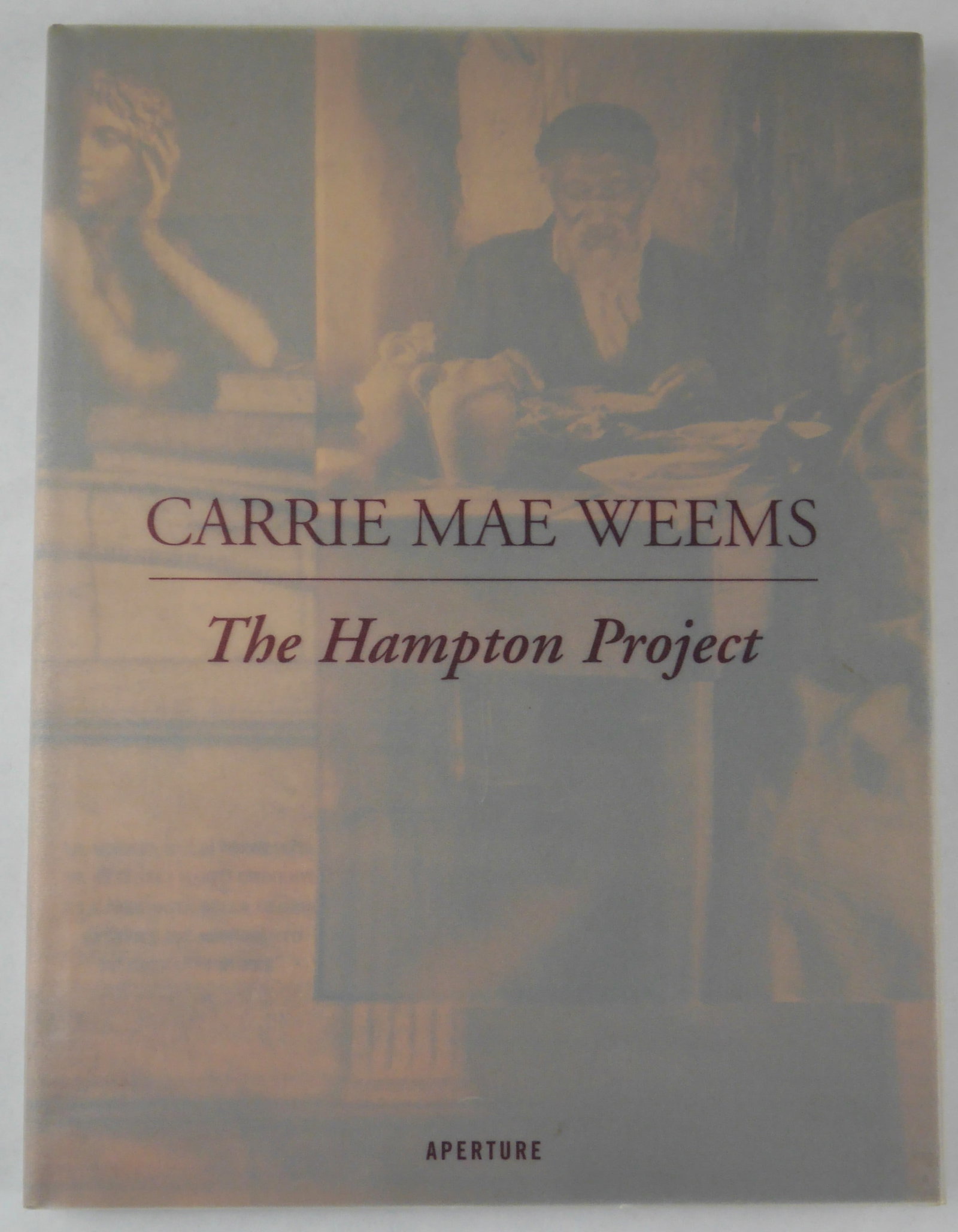 Carrie Mae Weems The Hampton Project [SIGNED - 2001 APERTURE 1ST EDITION 1ST PRINTING - FINE]: Aperture, 2001. Hardcover in tanslucent dust jacket. First Editon, First Printing (with the full numberline ending in 1). 12 x 9 inches. 96 pages with numerous photographic images throughout. Includes