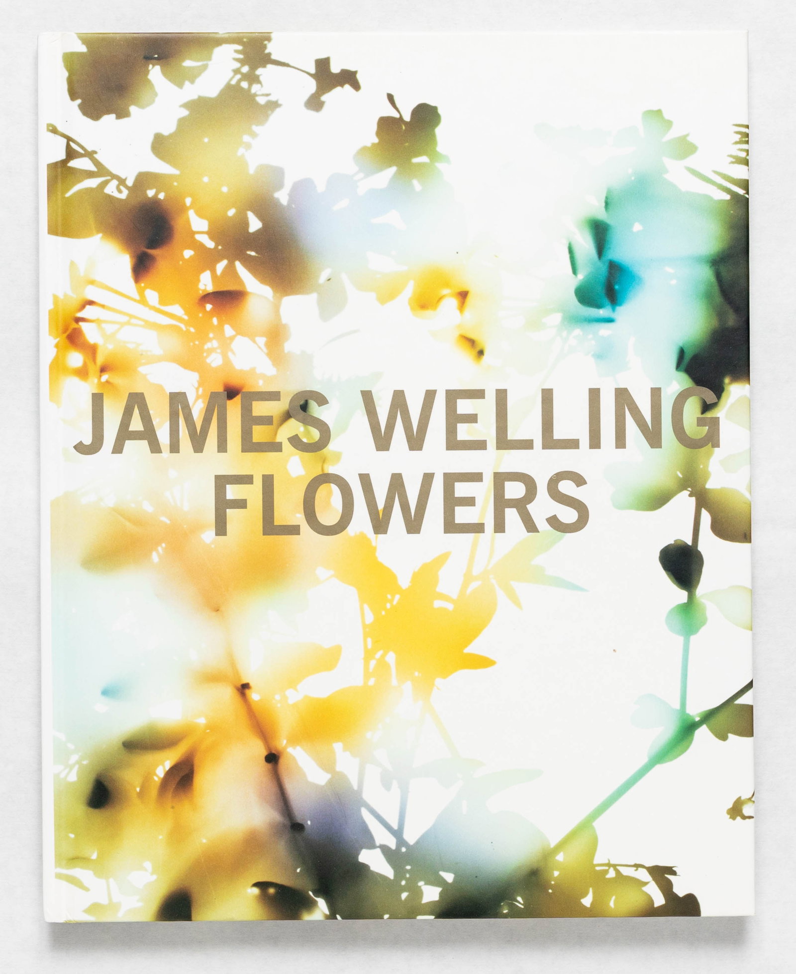 James Welling: Flowers [SIGNED 2007 1ST EDITION - FINE]: David Zwirner Books, 2007. Hardcover in pictorial boards with clear acetate Dust Jacket. First Edition, First Printing. 64 pages with 37 color photographic images throughout. SIGNED/INSCRIBED by James