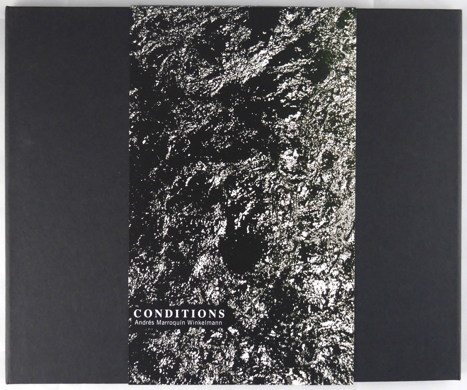 Winkelmann, Andres Marroquin; Conditions [LIMITED EDITION 1/300]: Meier und Muller, 2010. Hardcover with belly band. 128 pages with 56 color photographic images bound in a left and right binding. 10" x8". Limied edition of only 300 copies issued worldwide. BOOK COND