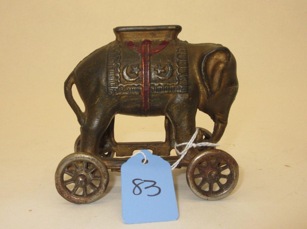 AC WILLIAMS ELEPHANT ON WHEELS CAST IRON BANK 4" LONG (1 of 4)
