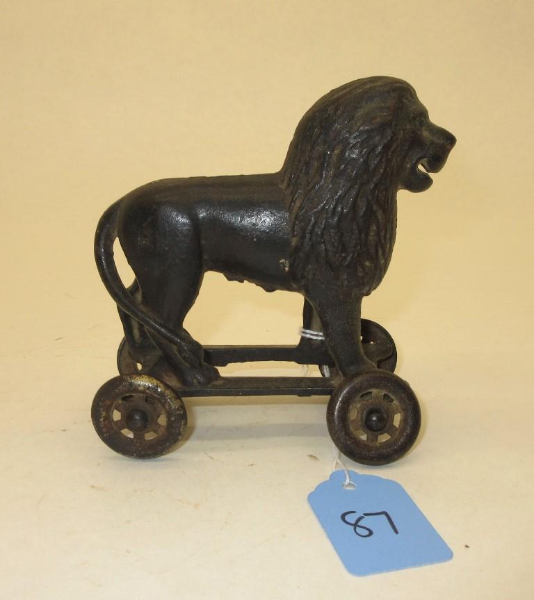 AC WILLIAMS CAST IRON LION ON WHEELS BANK 4 1/2" TALL (1 of 3)