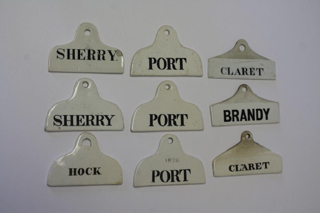 lot of 9 antique porcelain liquor labels for Sherry,: lot of 9 antique porcelain liquor labels for Sherry, Port, Claret, Hock & Brandy - Port are sgnd Copeland - approx 5 1/2" long