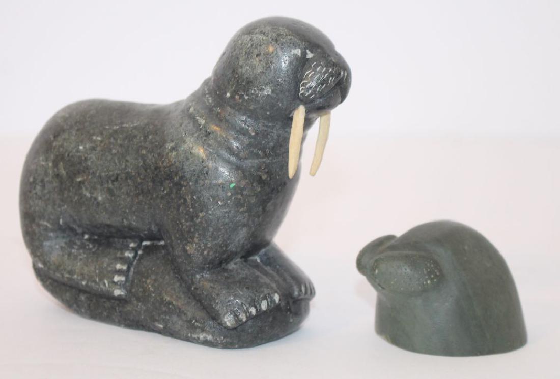 lot of 2 Inuit stone carved walrus - sgnd & numbered -: lot of 2 Inuit stone carved walrus - sgnd & numbered - 4" long example w bone tusks & a 1 1/2" tall head