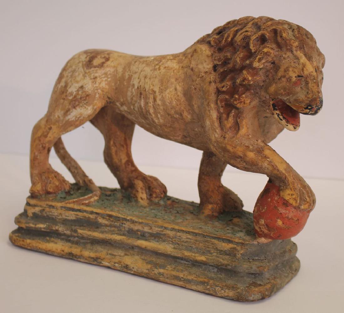 Mid 19th C earthenware lion w ball sculpture well: Mid 19th C earthenware lion w ball sculpture well detailed casting, worn early dry painted surfaces. Minor expected imperfections.