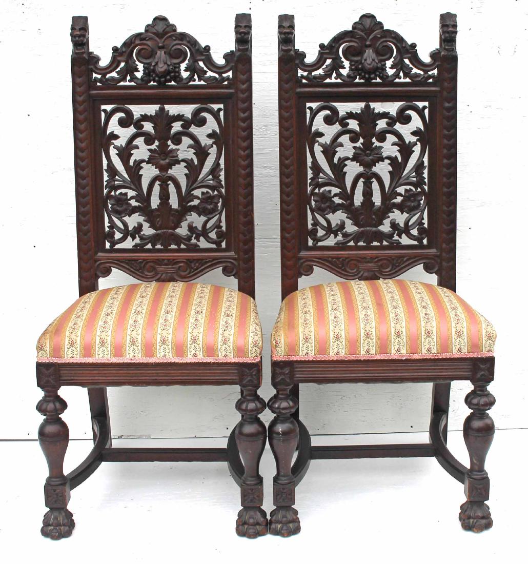 pr of late Victorian heavily carved chairs w lion head: pr of late Victorian heavily carved chairs w lion head finials & paw feet - 46" tall