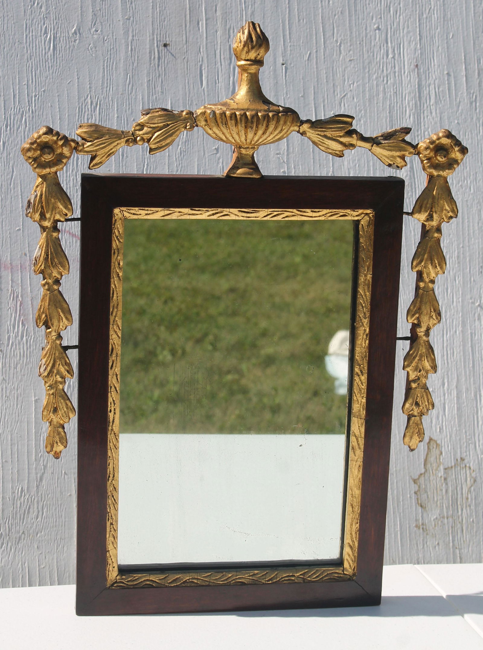 antique courting mirror with gold gilt urn, floral, and: antique courting mirror with gold gilt urn, floral, and leaf applied decoration - overall 19"x14"
