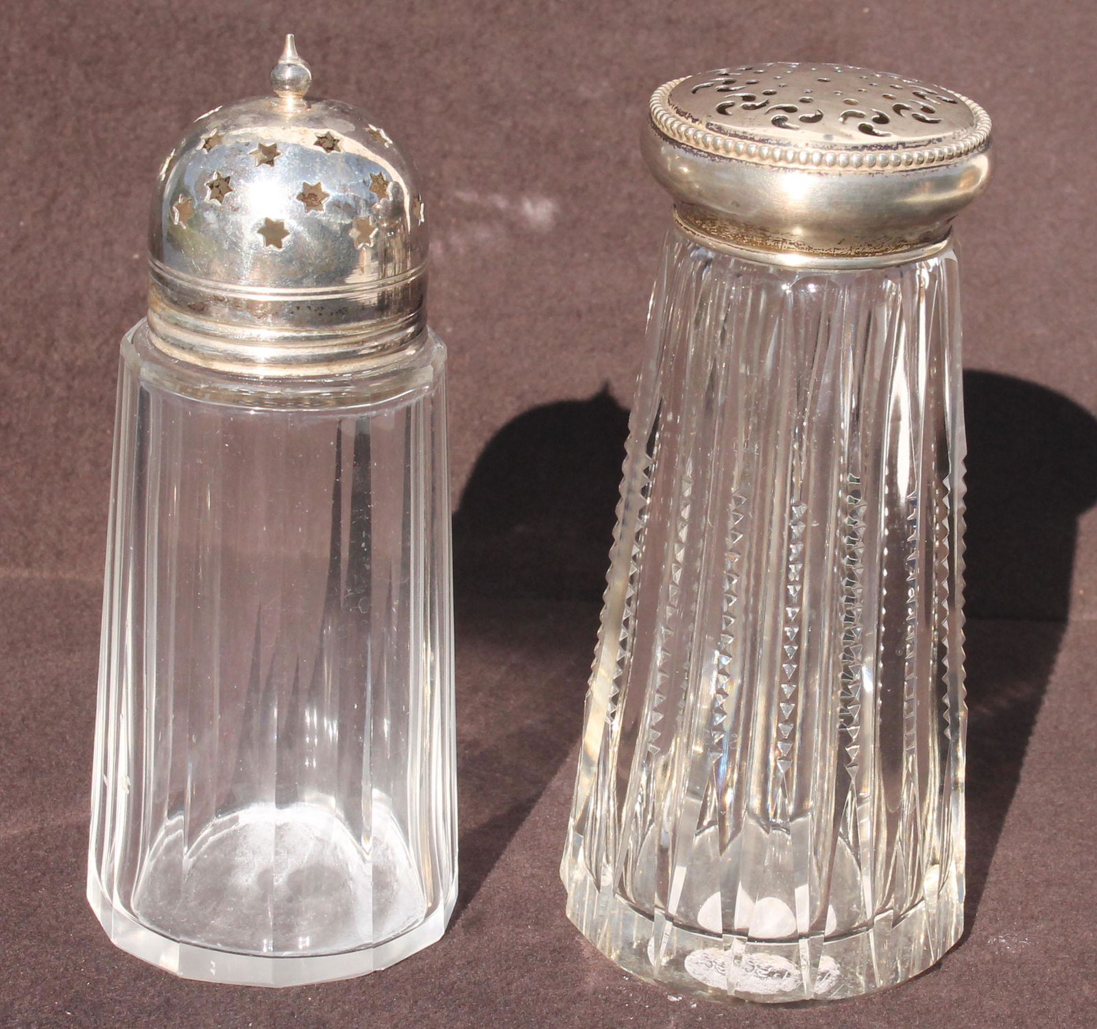 etched glass and cut glass condiment jars - 7 1/2" tall: etched glass and cut glass condiment jars - 7 1/2" tall and 5" tall plus 2 pressed glass muffineers with sterling tops - both 5 1/2" tall