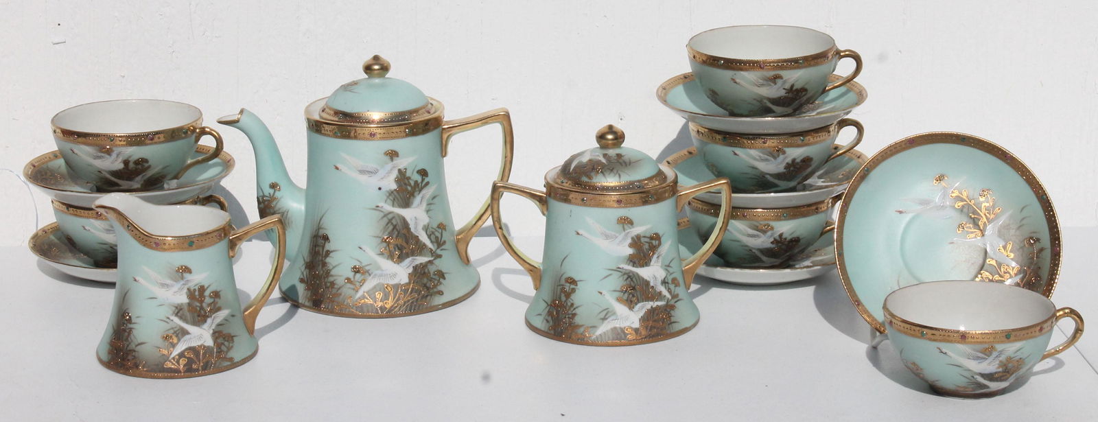 Antique signed Nippon hand painted tea set including: Antique signed Nippon hand painted tea set including tea pot, creamer, sugar, and six tea cups with saucers marked made in Japan plus antique Nippon berry set - 7pcs, 10" diameter for large bowl