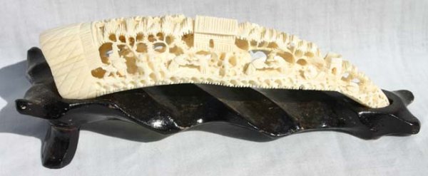 Hippo tooth carved village - 6 1/2"