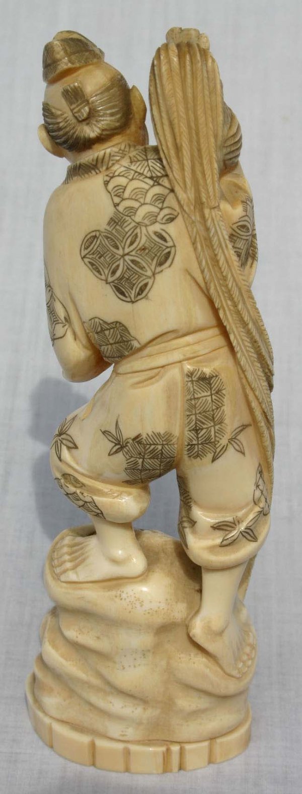 7 1/2" carved ivory figure of a man holding roost - 2