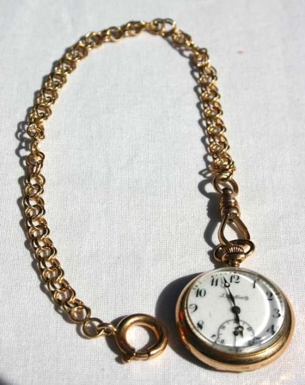 14k gold pocket watch marked Lewkowitz on gold cha