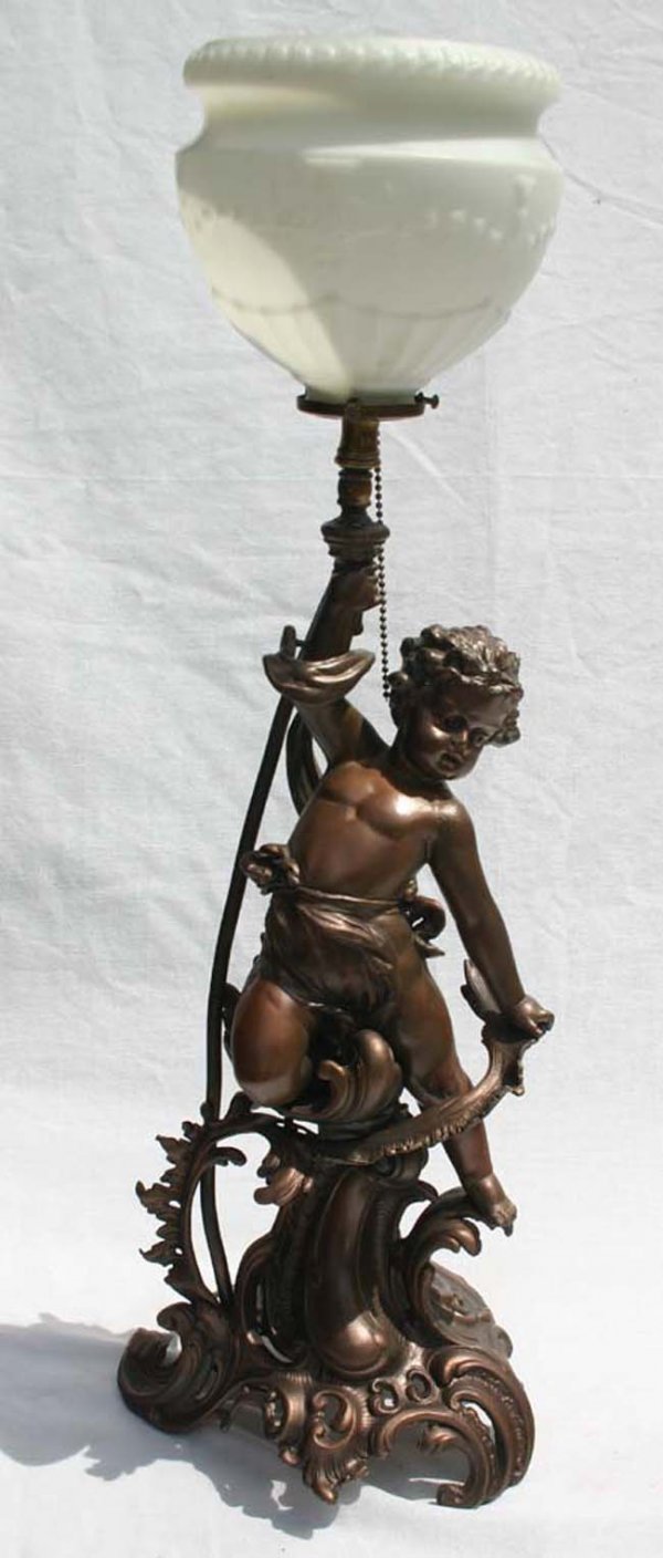 child figural torch bearer lamp