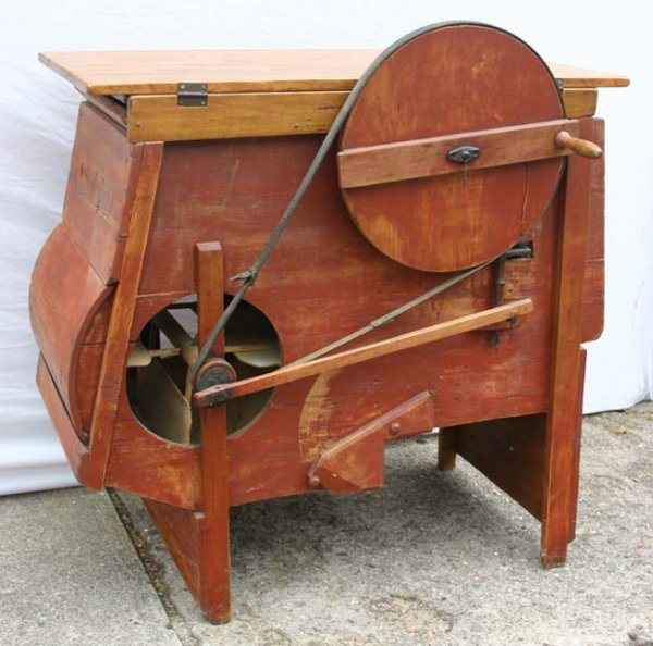 antique winnower in old red paint converted to a t
