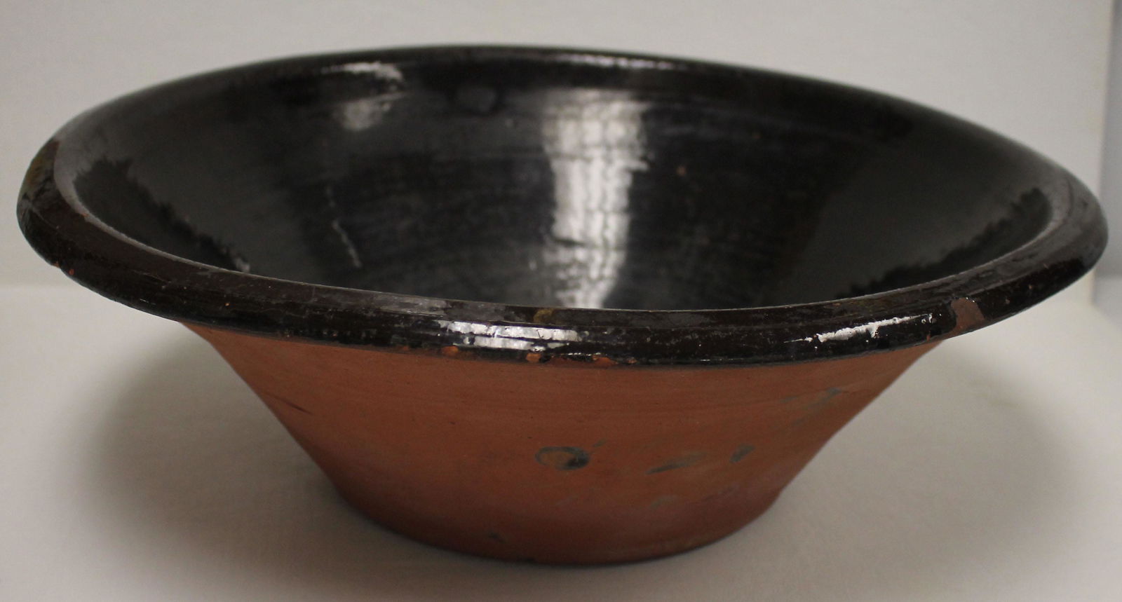 Lg 19thC redware milk pan w dark slip interior &: Lg 19thC redware milk pan w dark slip interior & unglazed exterior - 18" diam