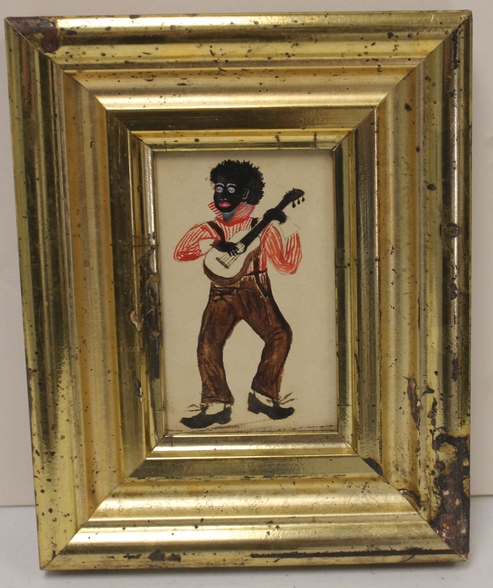 w/c depicting an African American man playing a banjo -: w/c depicting an African American man playing a banjo - inscribed on verso "Young Merrick as he looks in 188â€¦ the family from hattie with best wishes for a Merry Christmas" - 4 1/2" x 2 3/4" sig
