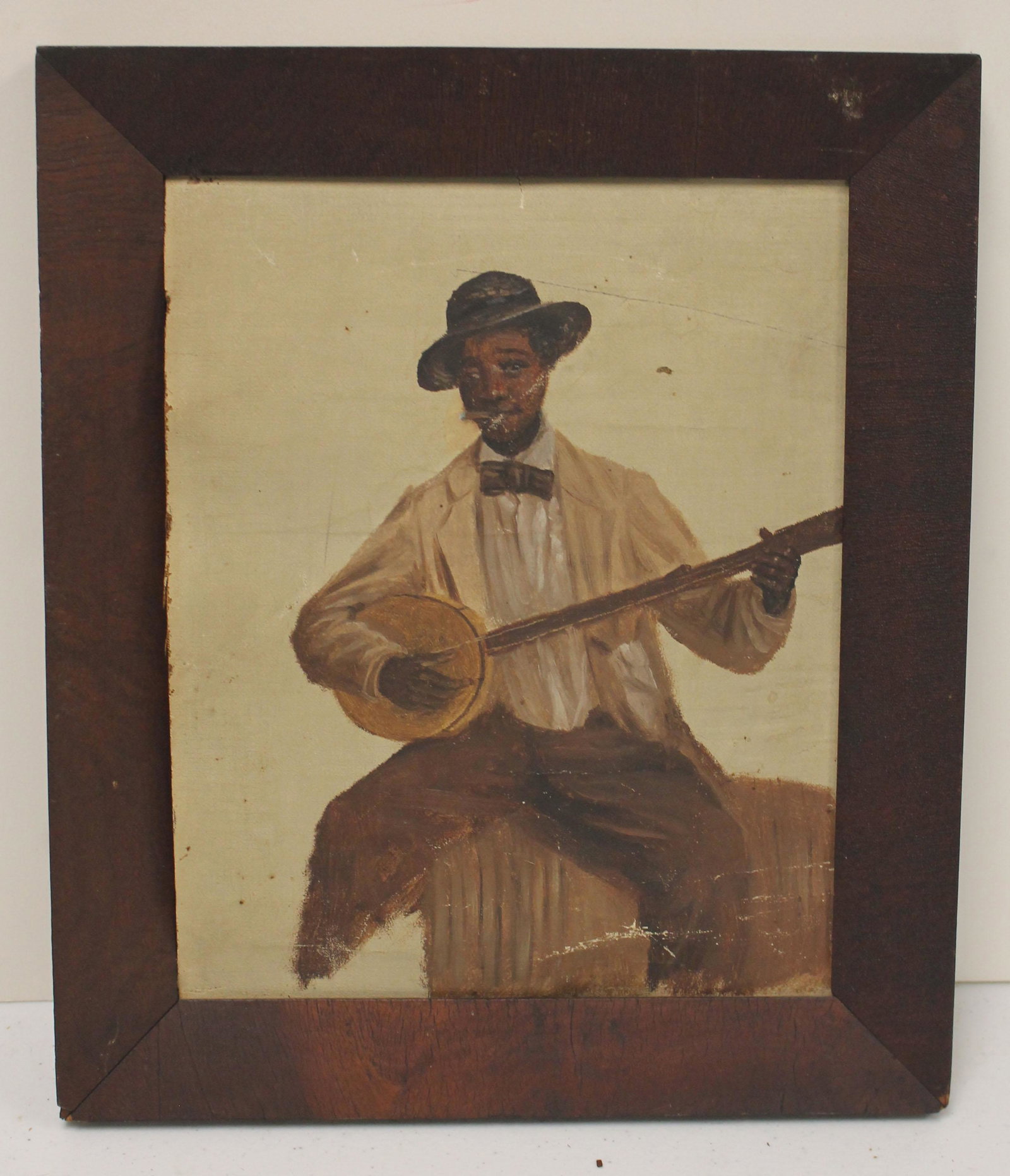 unsgnd o/c depicting an African American man playing a: unsgnd o/c depicting an African American man playing a banjo - 10 1/2" x 8 1/2"