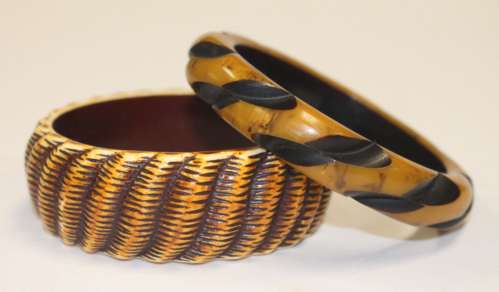 2 Vintage Bakelite carved bone & black bangle bracelets: 2 Vintage Bakelite carved bone & black bangle bracelets - 3 1/4" diam