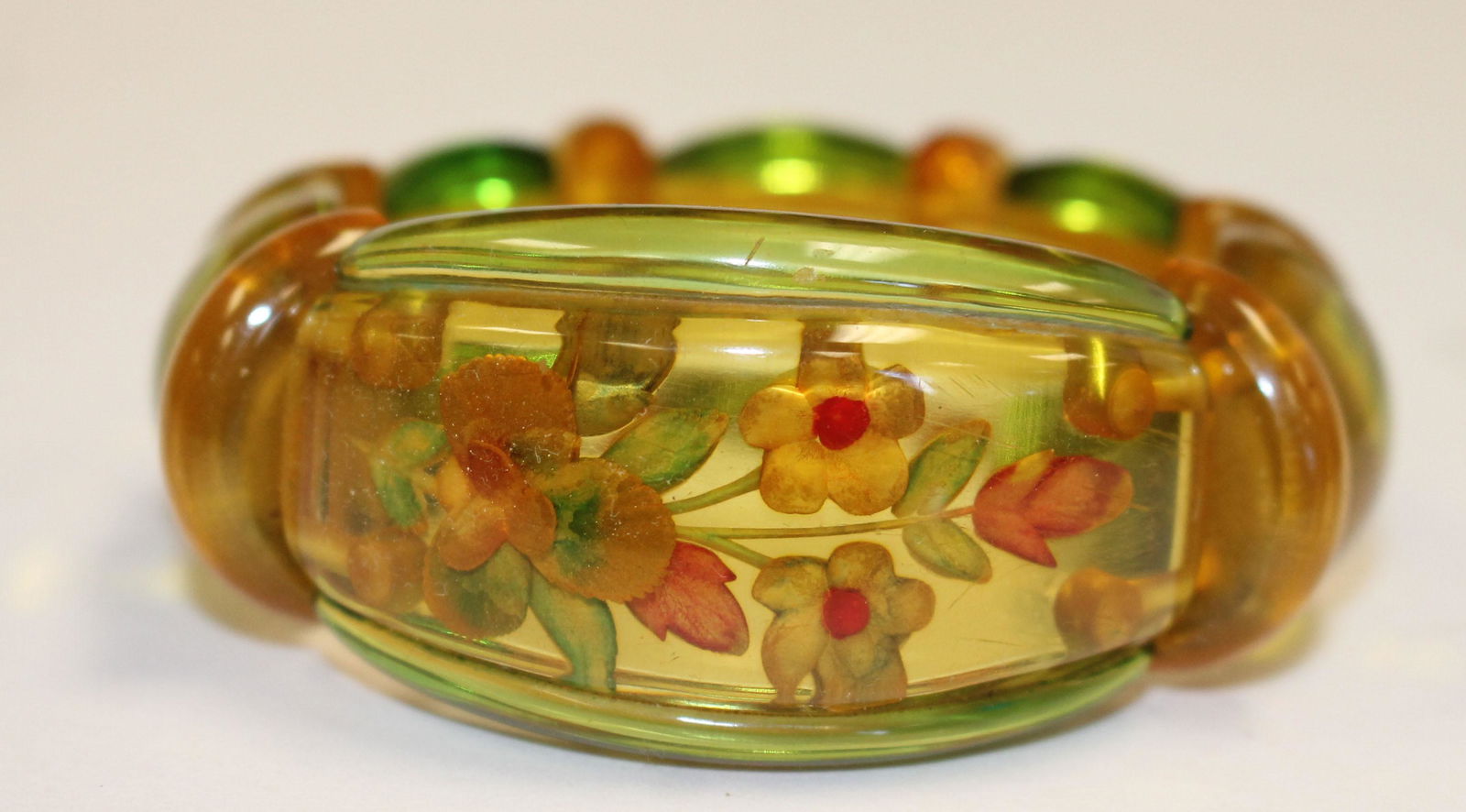 Vintage Bakelite apple juice reverse carved floral (1 of 2)