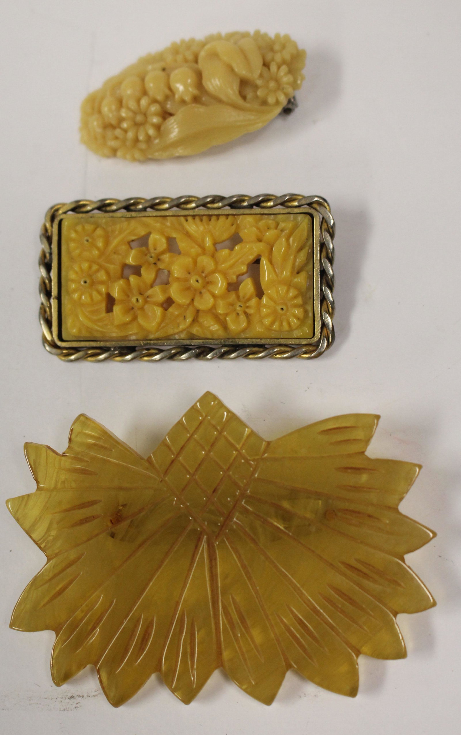 3 Vintage Bakelite carved floral pins & clip: 3 Vintage Bakelite carved floral pins & clip