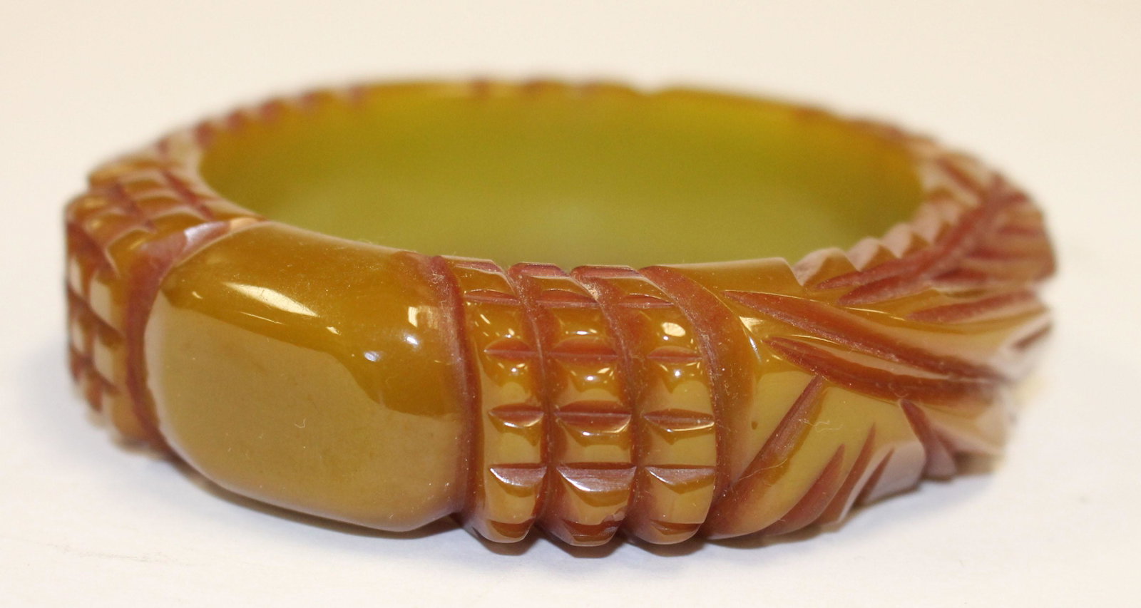 Vintage Bakelite carved bangle in olive & overdyed dec: Vintage Bakelite carved bangle in olive & overdyed dec - 3 1/4" diam