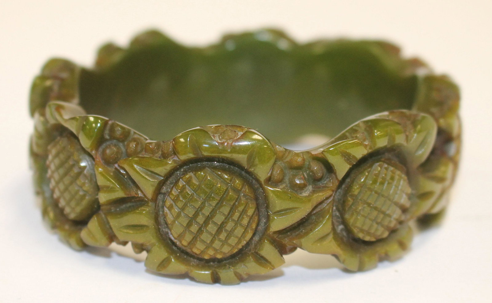 Bakelite reproduction carved sunflower bangle bracelet: Bakelite reproduction carved sunflower bangle bracelet - 3 1/4" diam