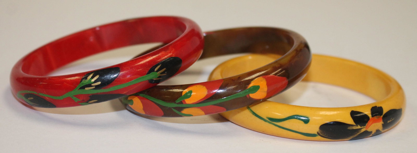 3 Vintage Bakelite floral paint dec bangles in yellow,: 3 Vintage Bakelite floral paint dec bangles in yellow, brown & red - 2 3/4" diam