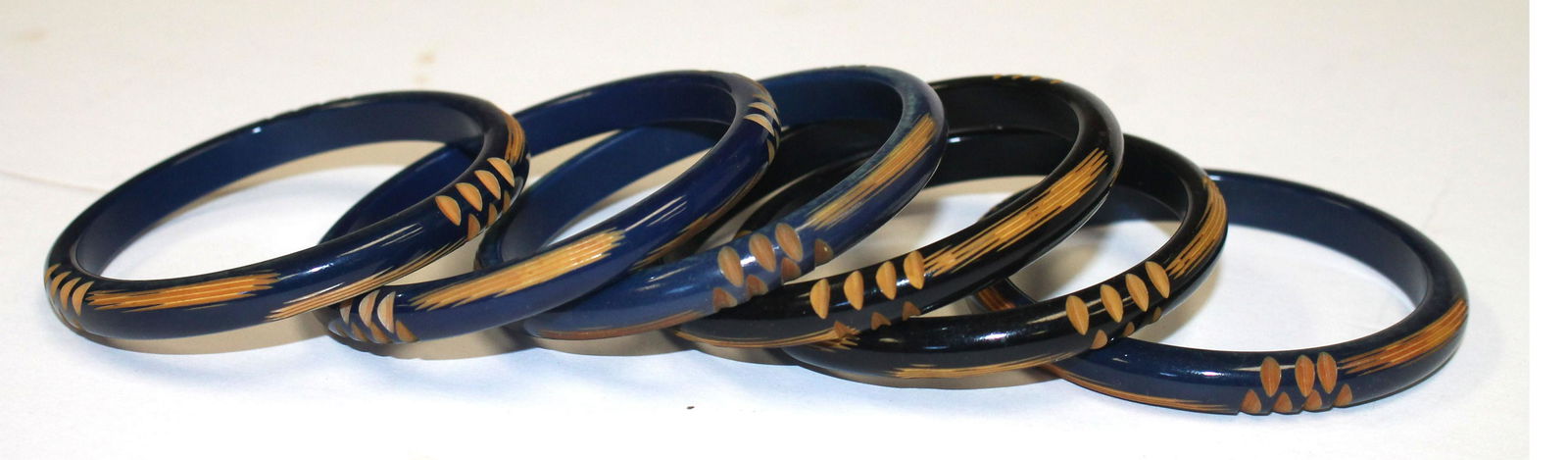 set of 6 Vintage Bakelite carved bangles in navy & (1 of 4)