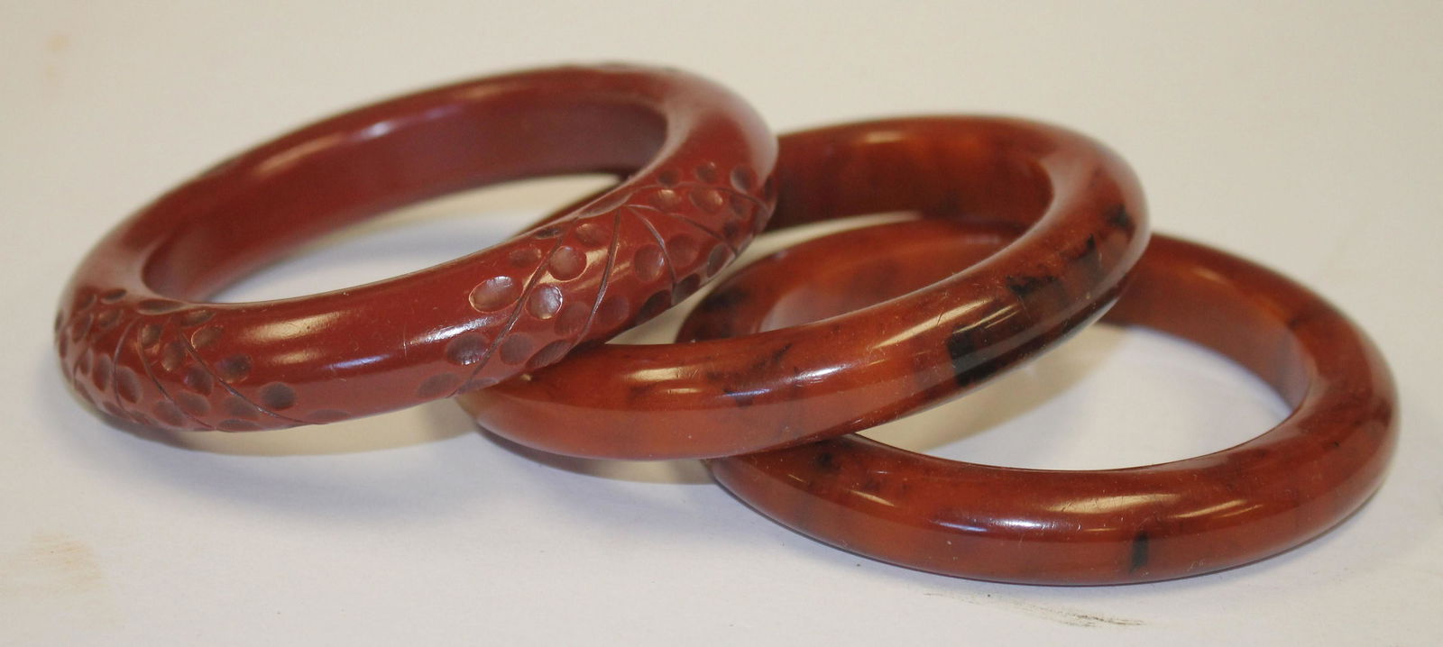 3 Vintage Bakelite carved orange/brown bangle bracelets (1 of 4)