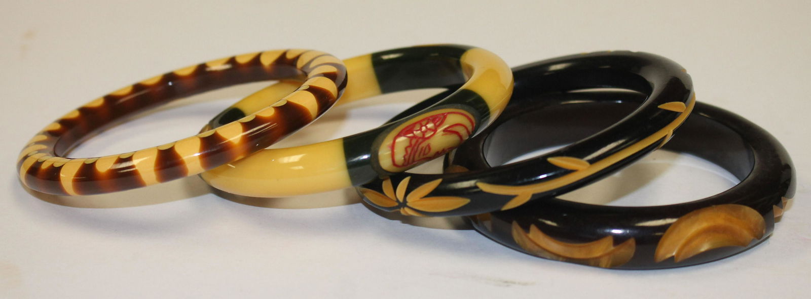3 Vintage Bakelite carved bangle bracelets 1 w face (1 of 5)