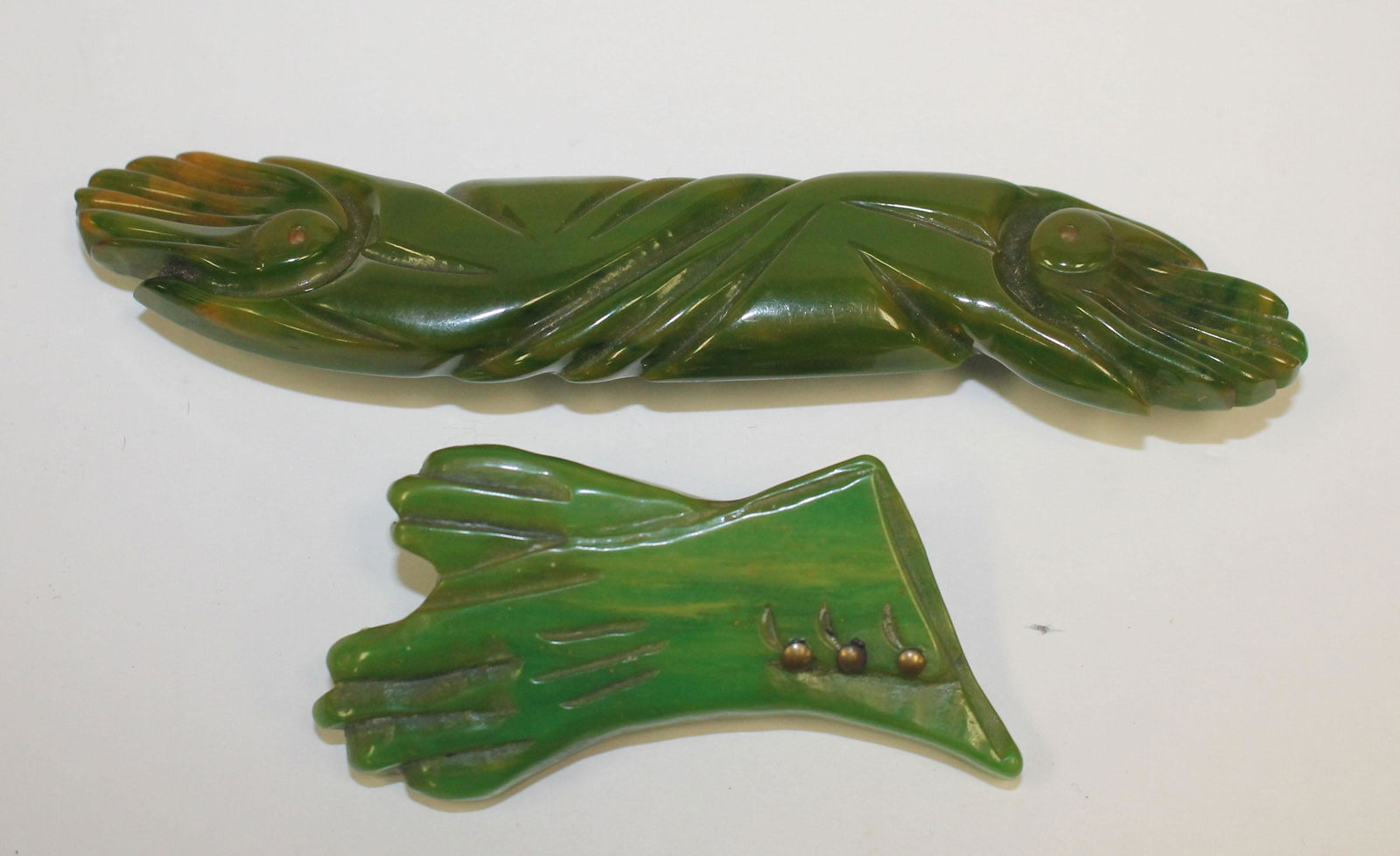 2 Vintage Bakelite marbled green hand & glove form pins (1 of 2)