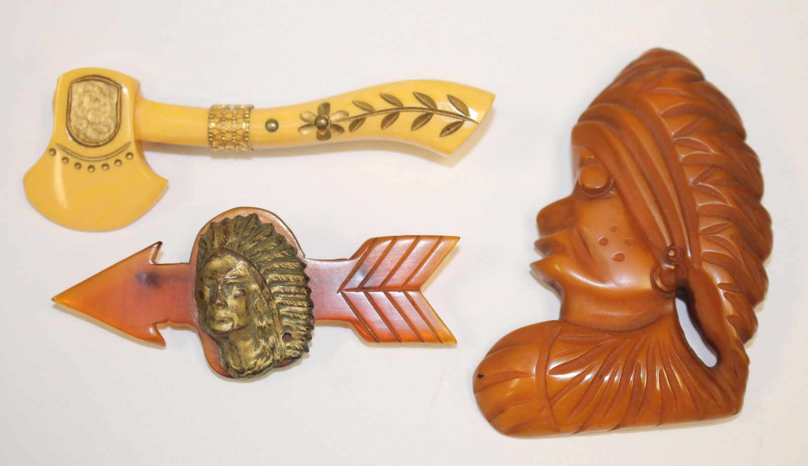 lot of 3 Vintage Bakelite Native American motif pins (1 of 4)