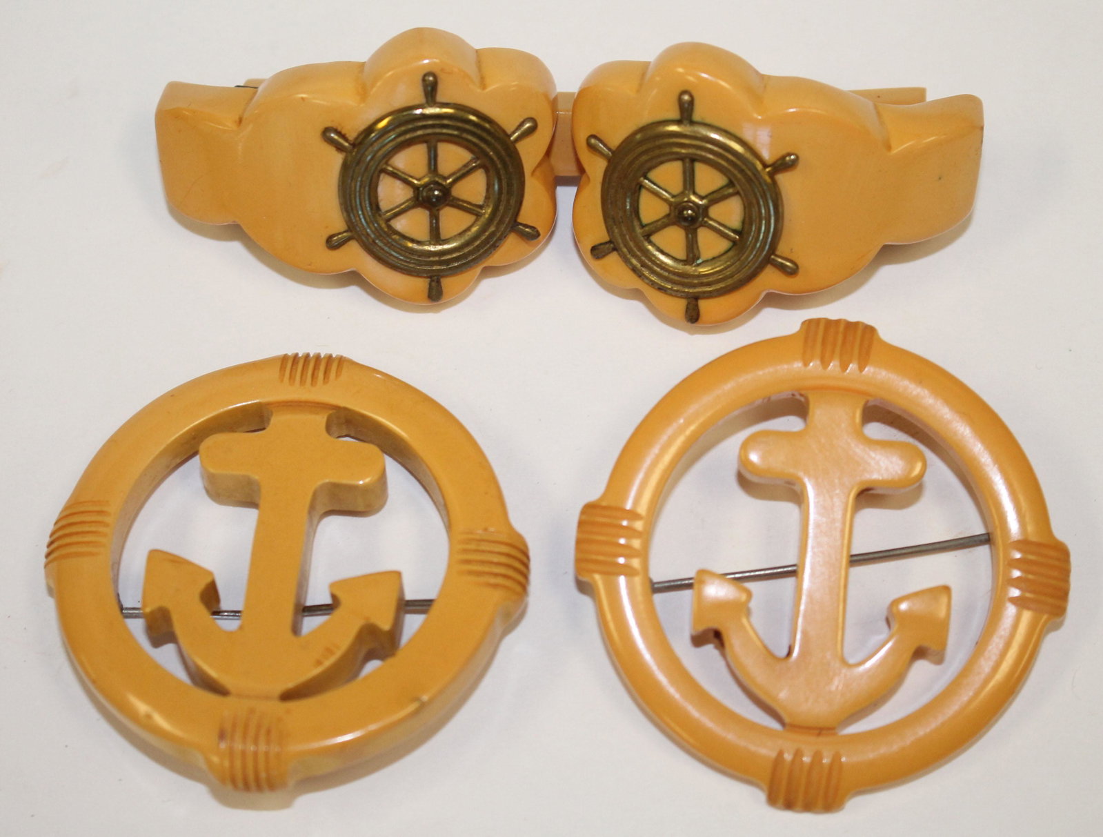 lot of 3 Vintage Bakelite butterscotch nautical motif: lot of 3 Vintage Bakelite butterscotch nautical motif pins - 3 1/4" & 2" diam