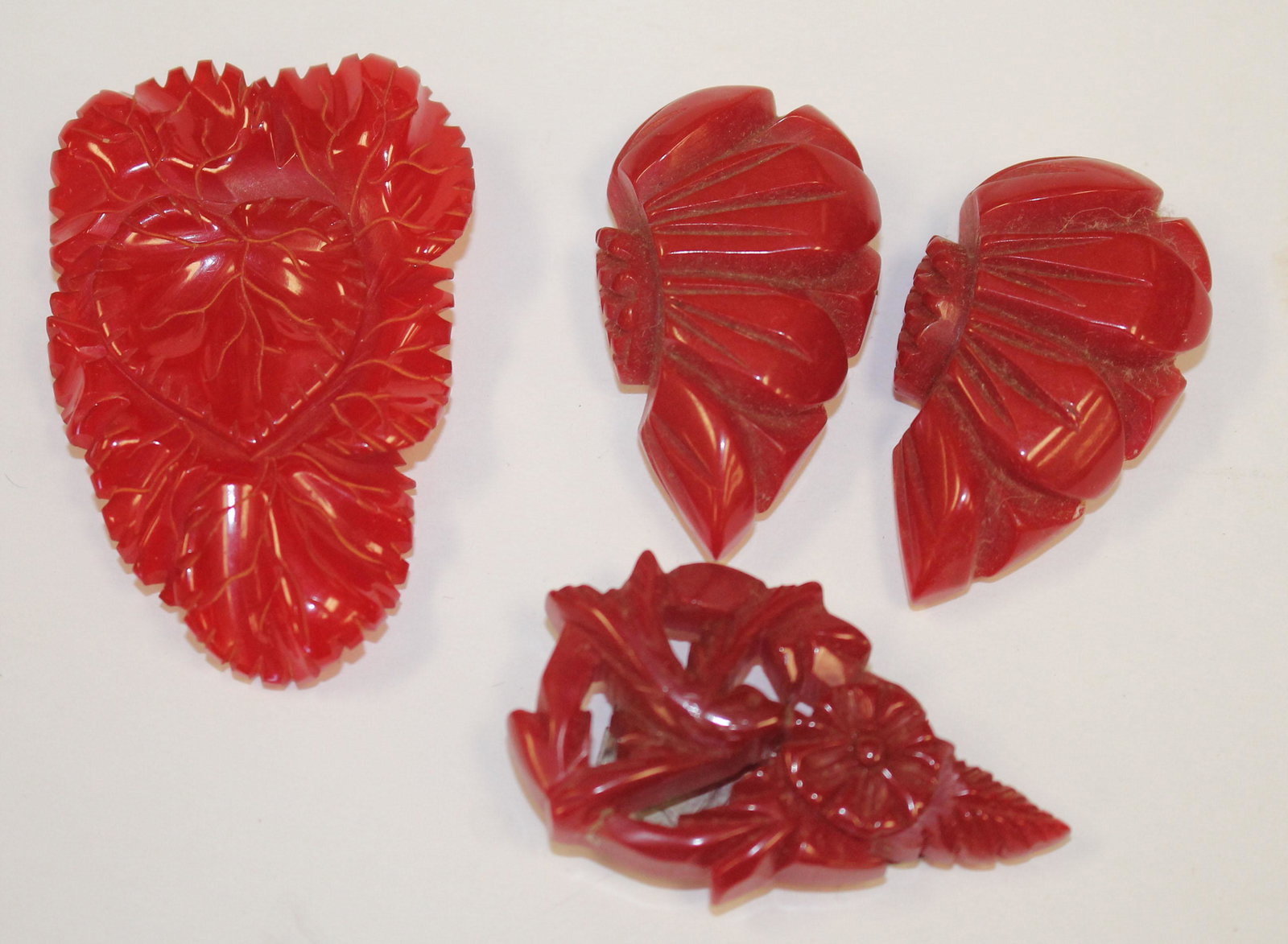 Vintage Bakelite carved red floral clips incl a pair -: Vintage Bakelite carved red floral clips incl a pair - 1 1/2" - 2"
