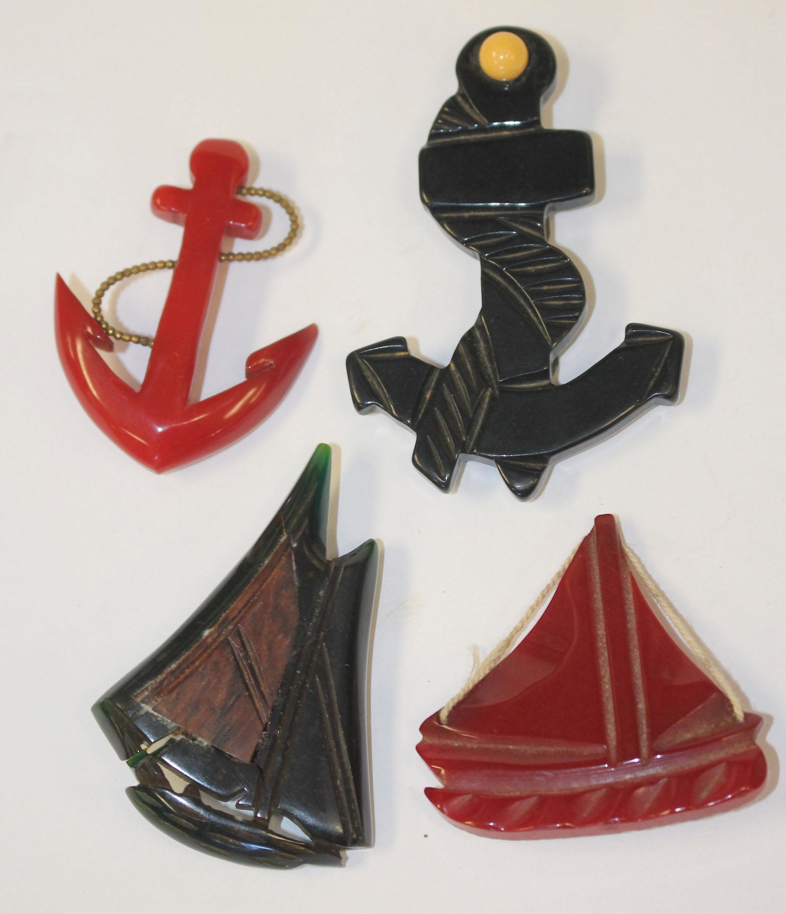 lot of 4 Vintage Bakelite nautical motif pins & clips: lot of 4 Vintage Bakelite nautical motif pins & clips incl anchors & sailboats - 2" - 3 3/4"