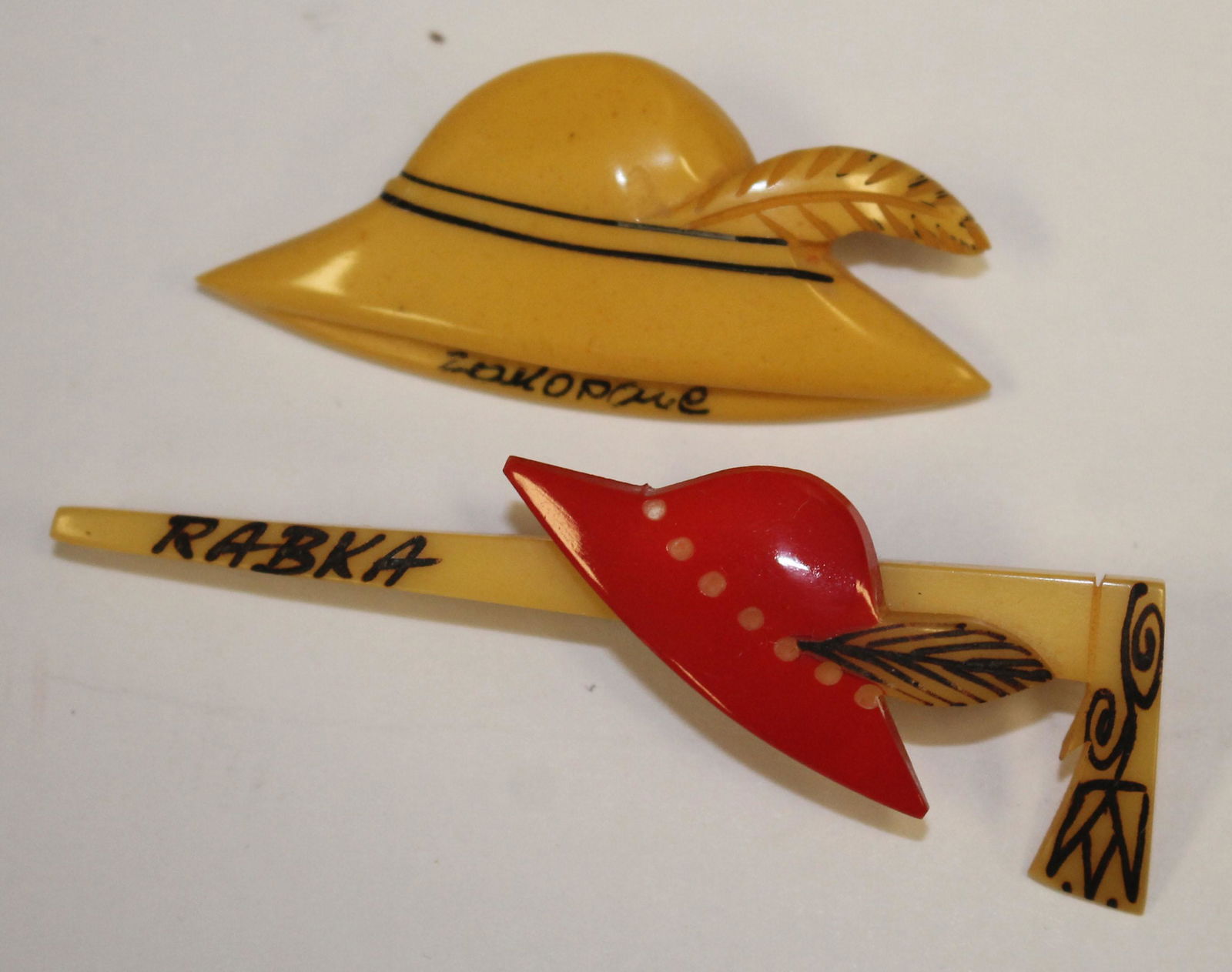 lot of 2 Vintage Bakelite hat form pins incl 1 Polish (1 of 2)