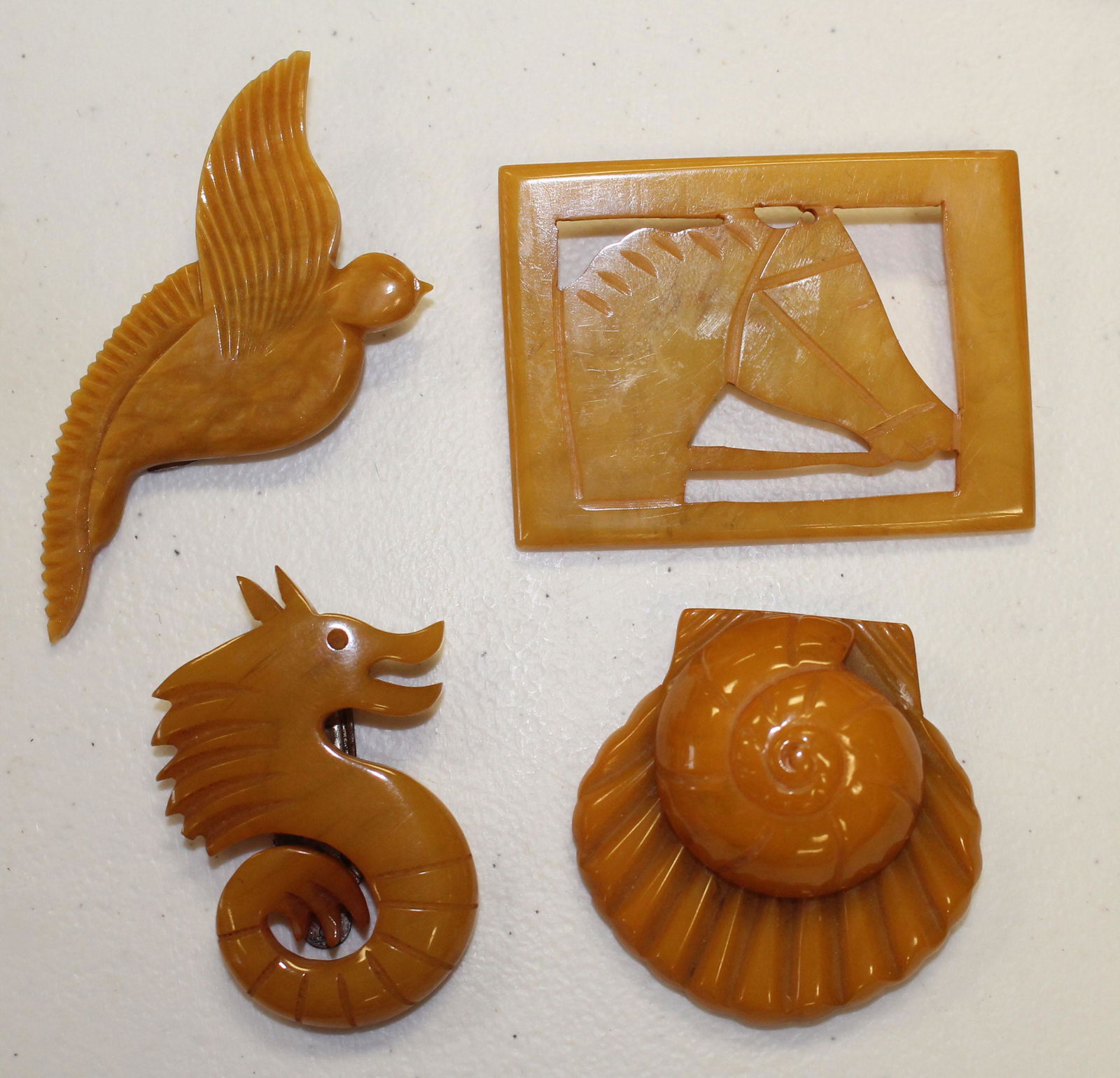 lot of 4 Vintage Bakelite carved butterscotch pins & (1 of 3)