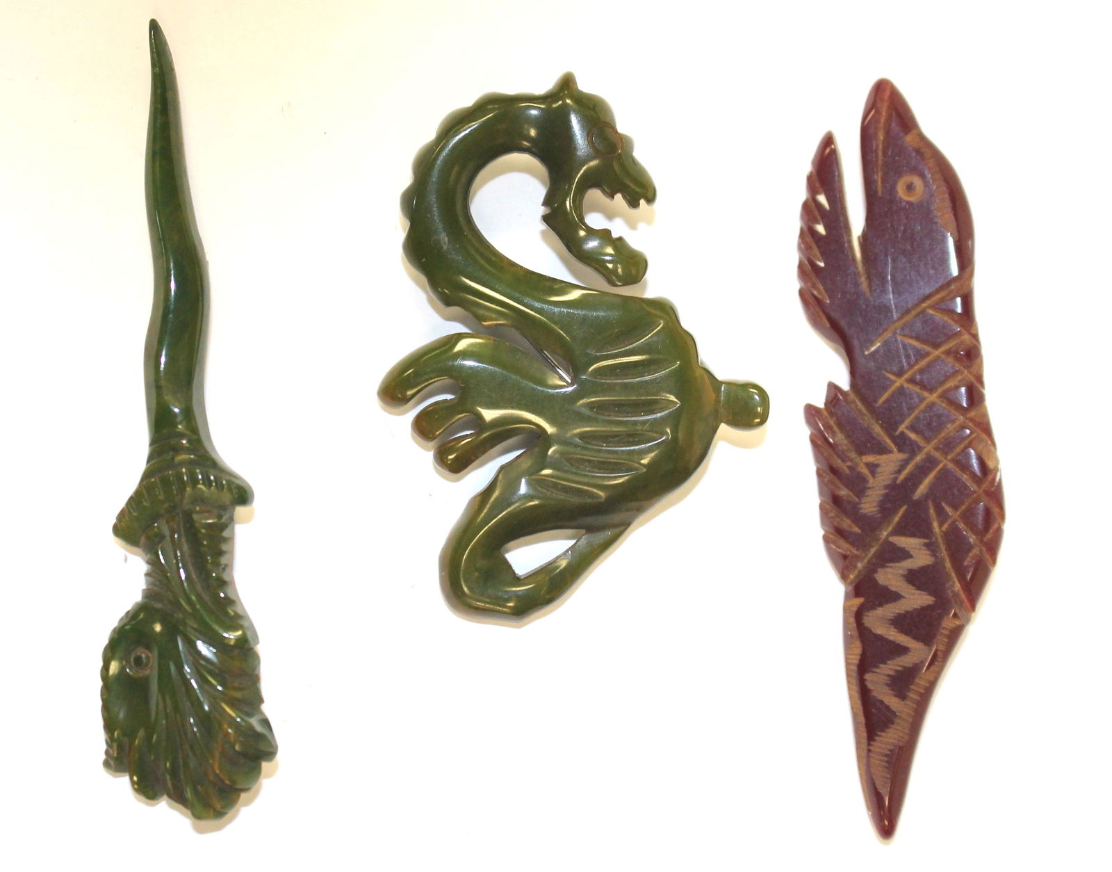 lot of 3 Vintage Bakelite carved figural dragon pins - (1 of 5)