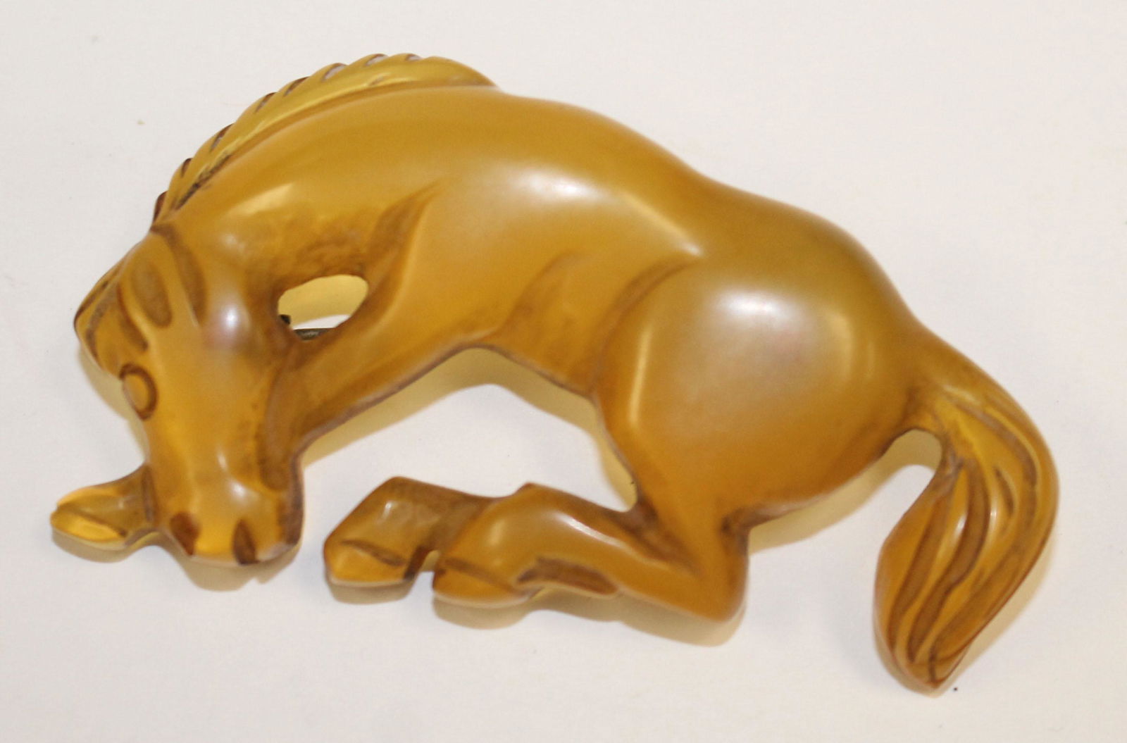 Vintage Bakelite or other plastic bronco pin (1 of 2)