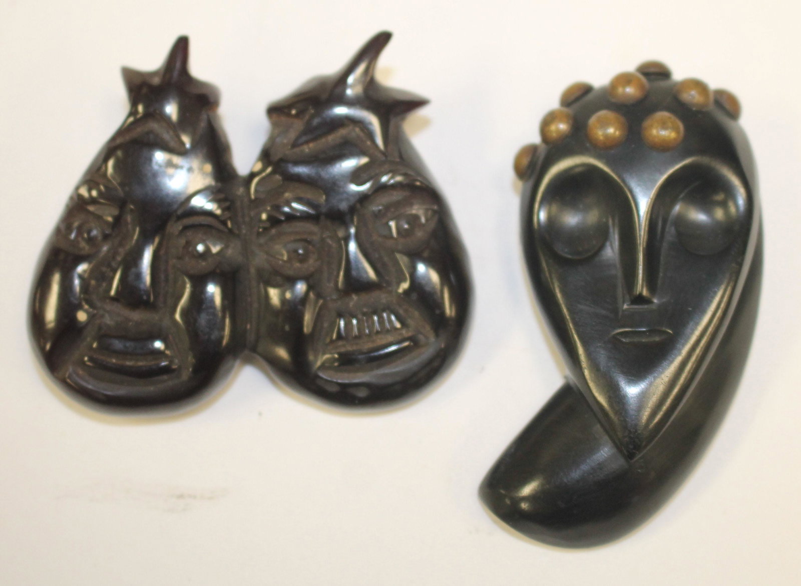 lot of 2 Vintage Bakelite pins - 1 fiigural face w: lot of 2 Vintage Bakelite pins - 1 fiigural face w metal applied dec - 2 1/2" & 2 theater faces - 2 1/4"